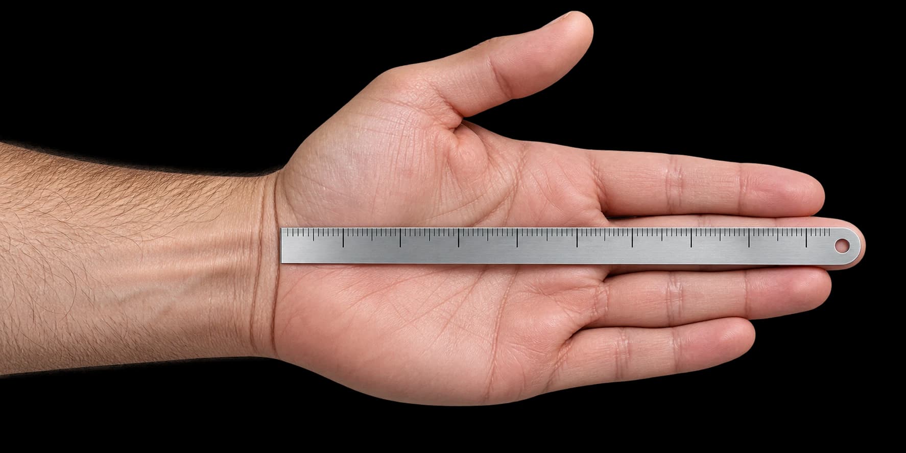 A palm-up lead hand measured from the wrist crease to the tip of the middle finger